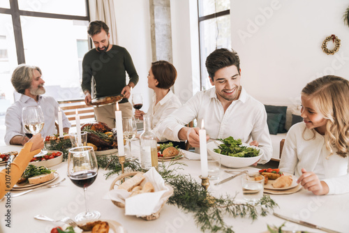 Happy big family celebrating Christmas together at home