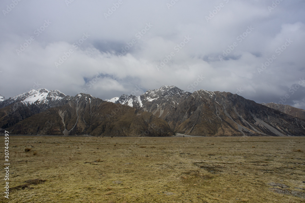 Mount Tasman view from dried field after winter season.