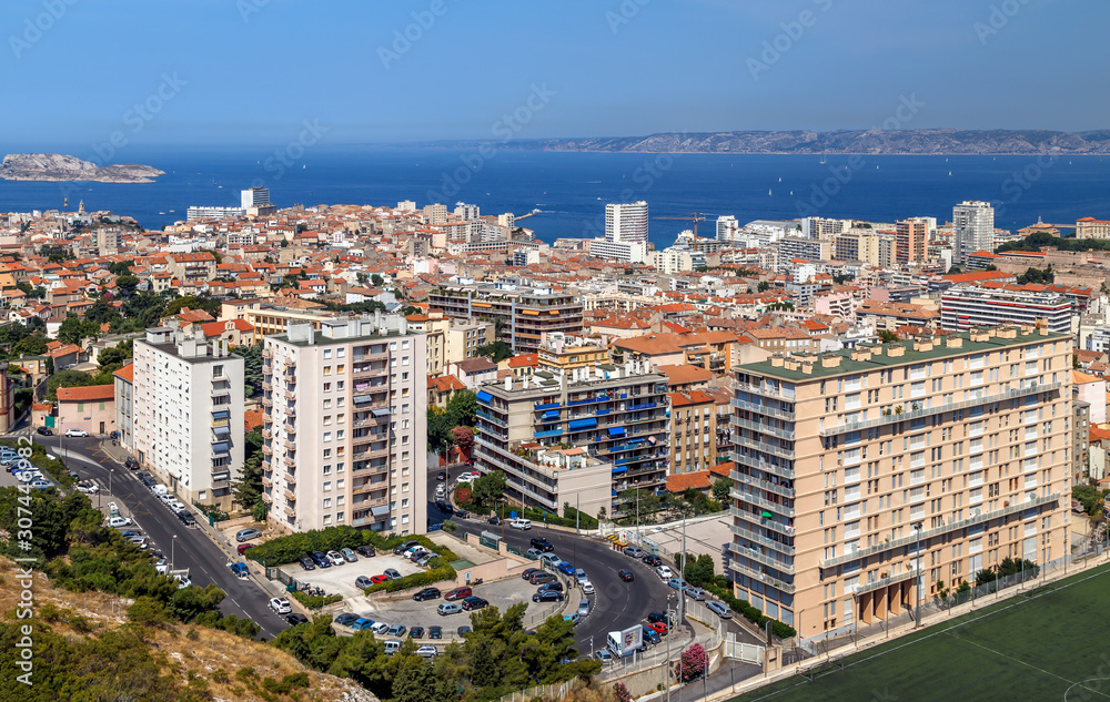 Marseille, France. Aerial panoramic view of the city, the bay and islands from the top of the hill in a summer sunny day. Holidays in France.