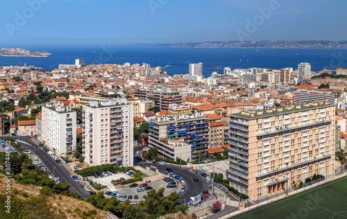 Marseille, France. Aerial panoramic view of the city, the bay and islands from the top of the hill in a summer sunny day. Holidays in France.