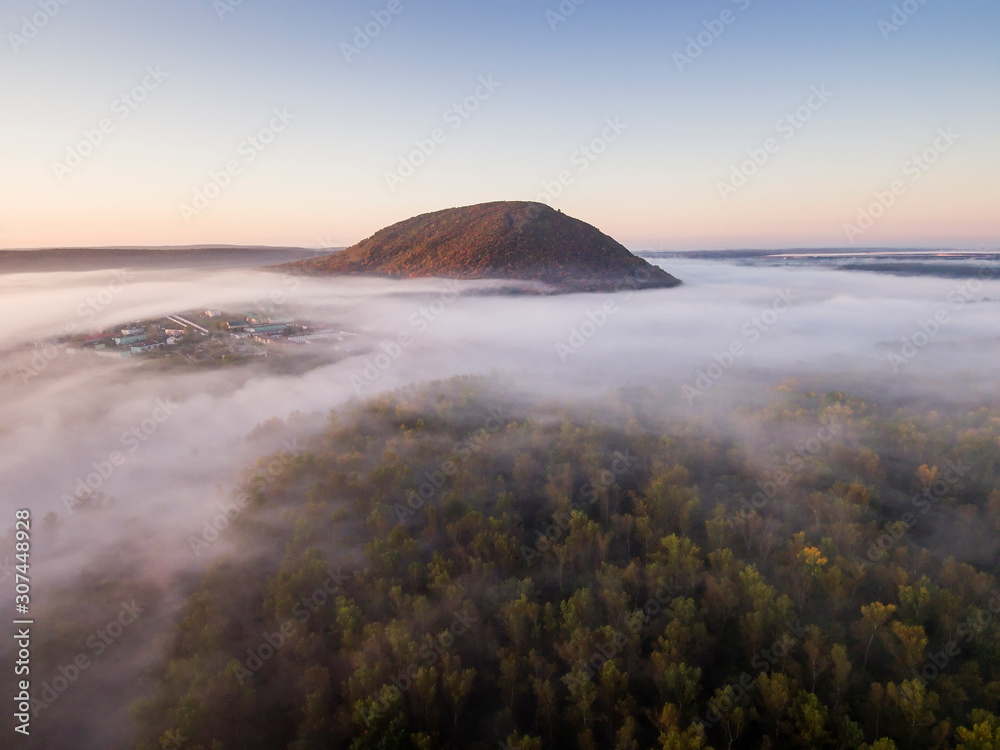 Fototapeta premium The remain of the reef of the ancient sea - solitary mountain Kushtau.