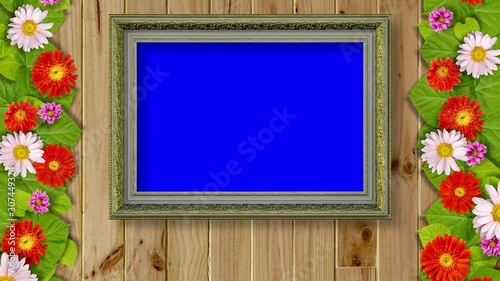 blank picture frame on the wooden wall