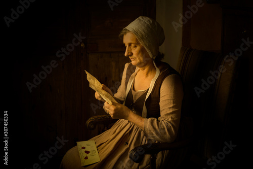 Rembrandt portrait of reading woman photo