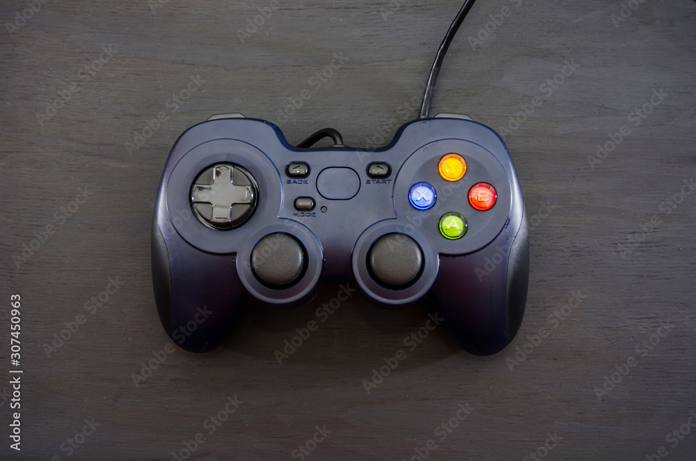 Gamepad on a black background. View from above.