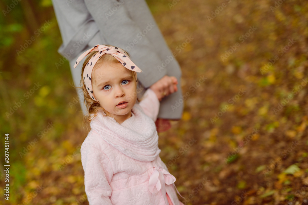beautiful little girl smiling on a sunny day. Blue eyes. head shot beautiful little girl smiling on a sunny day. Blue eyes. head shot