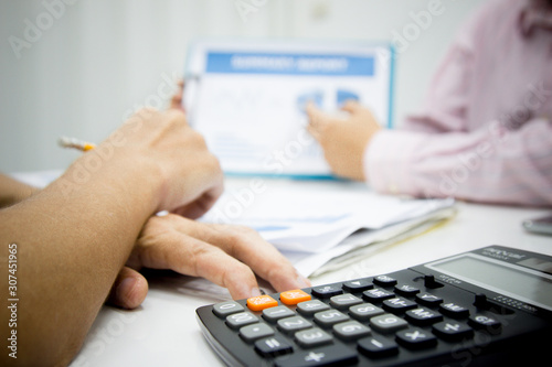 businessman working use present for Economic outlook  in office for discussing documents and ideas , with soft focus, vintage tone