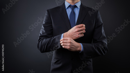 Man in black blue suit with tie