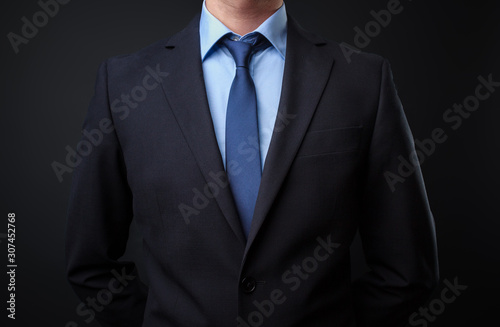 Man in black blue suit with tie