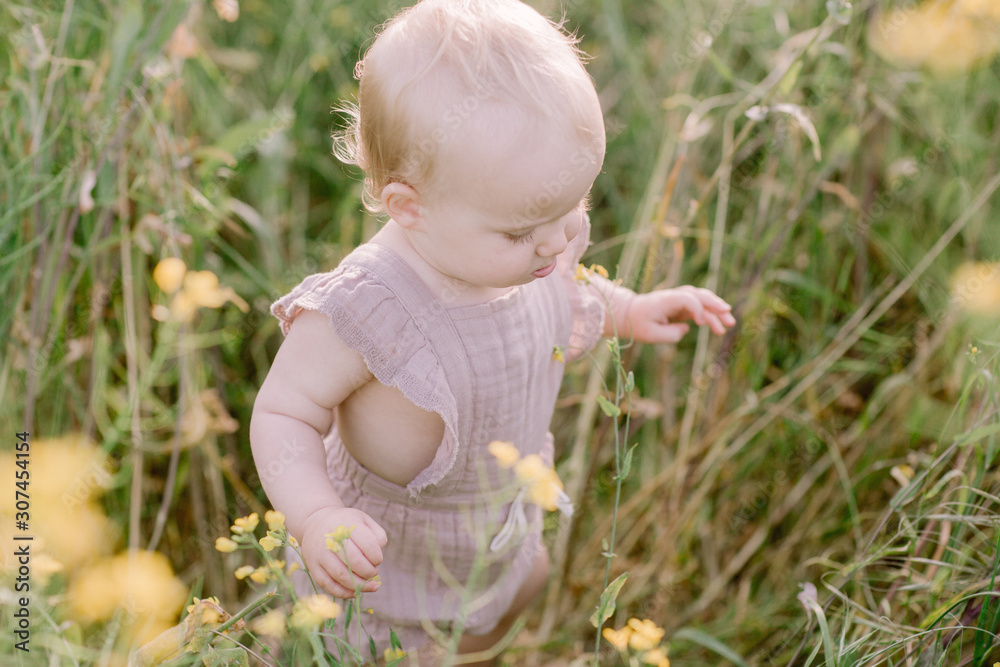 Baby Girl Exploring nature in Summer Baby Girl Exploring nature in Summer