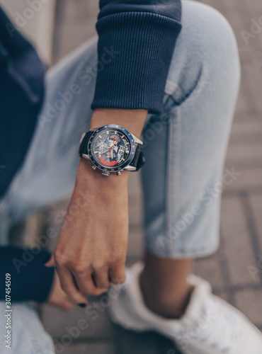 Beautiful stylish blue watch on woman hand