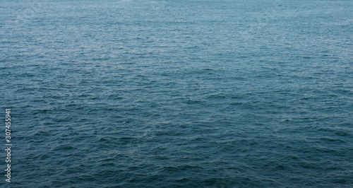 Dark blue ocean surface covered with waves