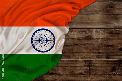 color national flag of modern state of india, beautiful silk, old wood background, concept of tourism, economy, politics, emigration, independence day, copy space, template, horizontal