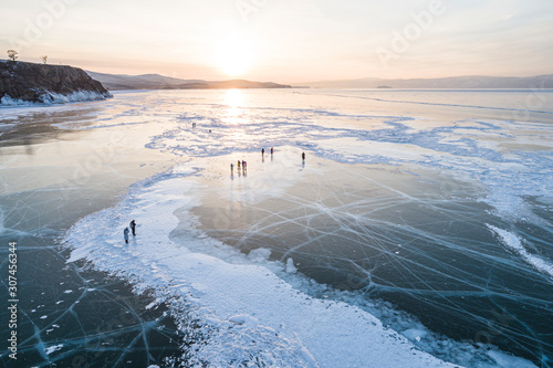 People walking on frozen lake