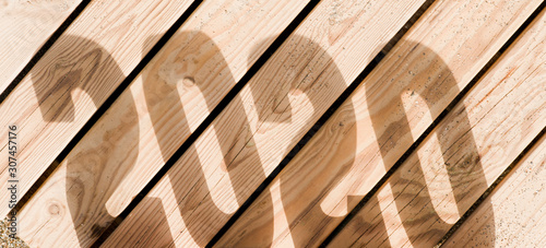 Fototapeta Naklejka Na Ścianę i Meble -  Creative inspiration concepts 2020 with text number performing shadow with wooden background. Business resolution, ideas for action plans. Shades of brown