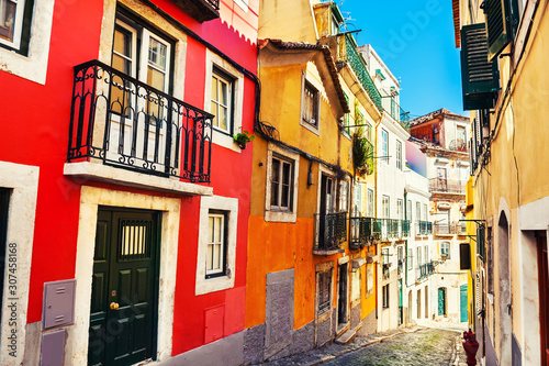 Colorful architecture in Lisbon, Portugal. View of the hills in Old town. Famous travel destination © smallredgirl