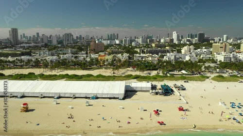 Aerial pull out shot Art Basel 2019 event tents on the beach photo