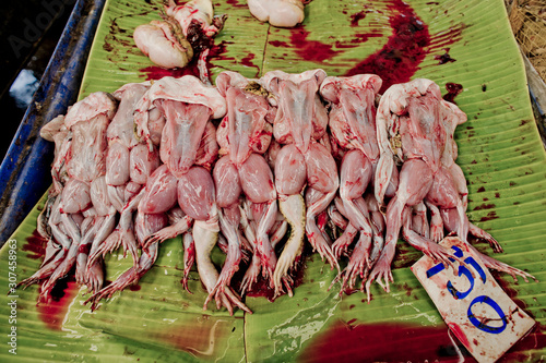 Frog meat for sale in an Asian street market photo