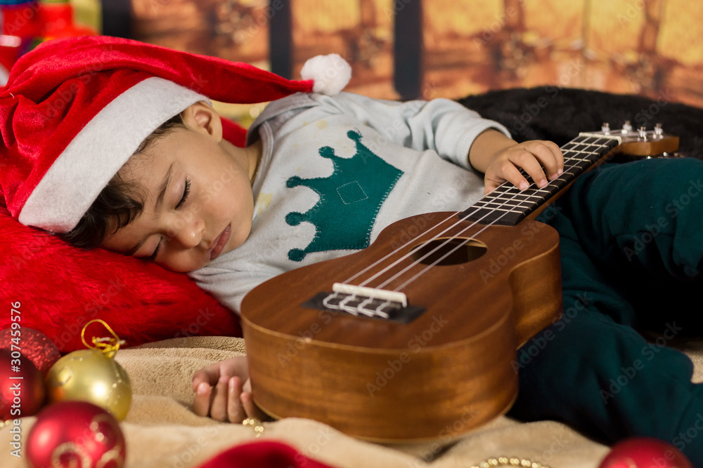 Bebê dormindo na noite de natal Photos | Adobe Stock Bebê dormindo na noite de natal Photos | Adobe Stock