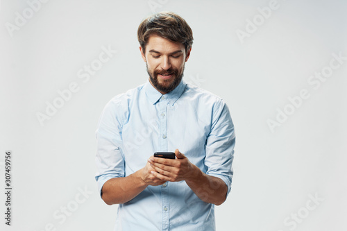 portrait of young man with mobile phone © SHOTPRIME STUDIO