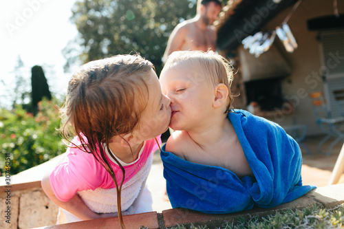 Brother and sister kissing
