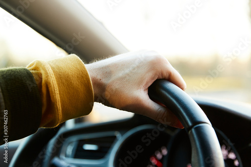 Hand on steering wheel photo