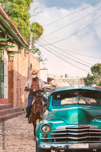 Photography Cuba classic car with horse rider