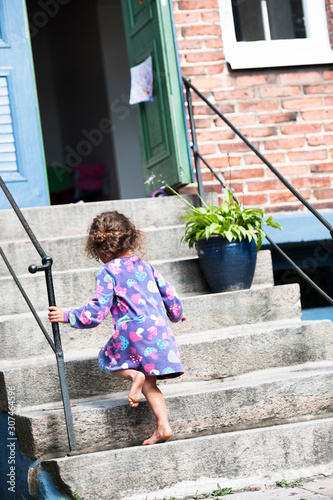 Girl walking up stairs photo