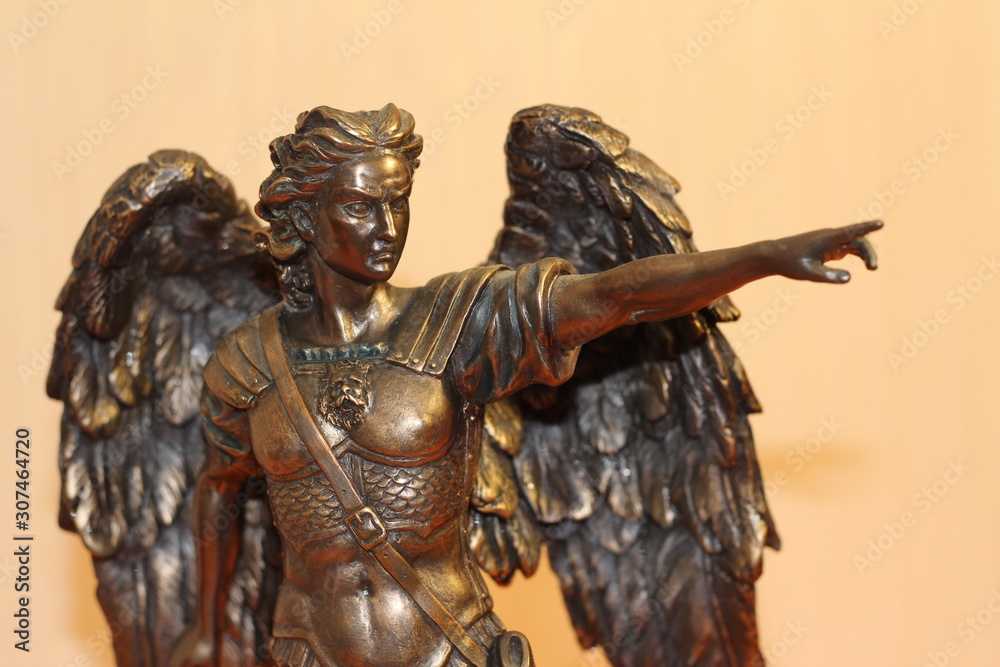 bronze sculpture of Archangel Michael with wings and sword Stock Photo ...
