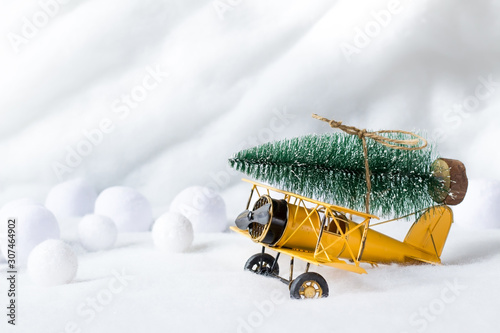 Fotografie Christmas tree on vintage airplane toy