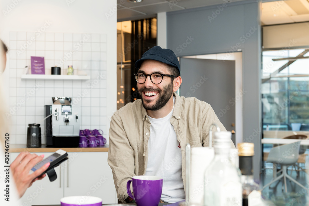 Smiling man in office cafeteria Smiling man in office cafeteria