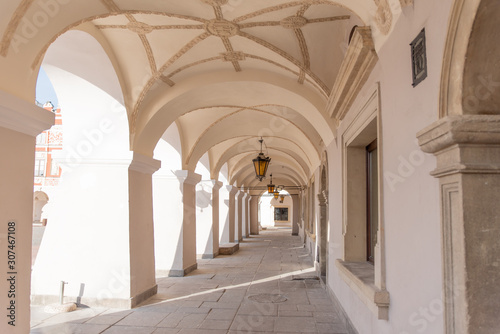Old renaissance or mannerist arcades of tenement house in Zamosc Poland, example of Lublin renaissance, renesans lubelski, ceiling covered with stucco mannerist ornaments