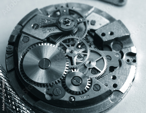 old mechanical watch mechanism, close up of small gears
