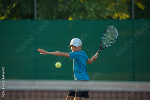 Boy playing tennis