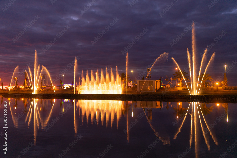 Fototapeta premium Beautiful fountain at sunset day on exposure in the city of Batumi, Georgia.