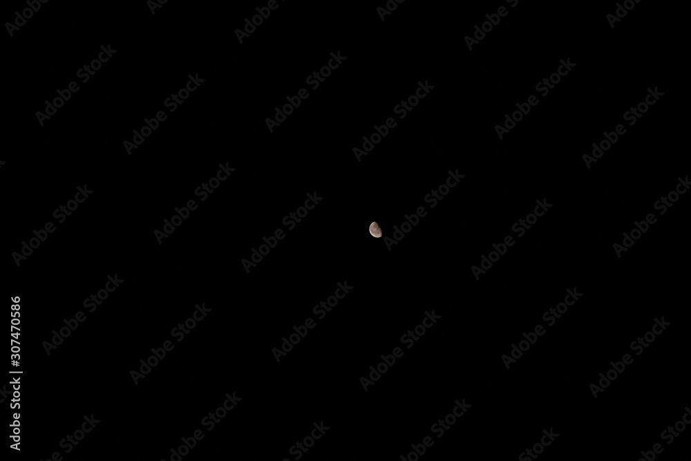 Small illuminated moon in the dark universe Small illuminated moon in the dark universe