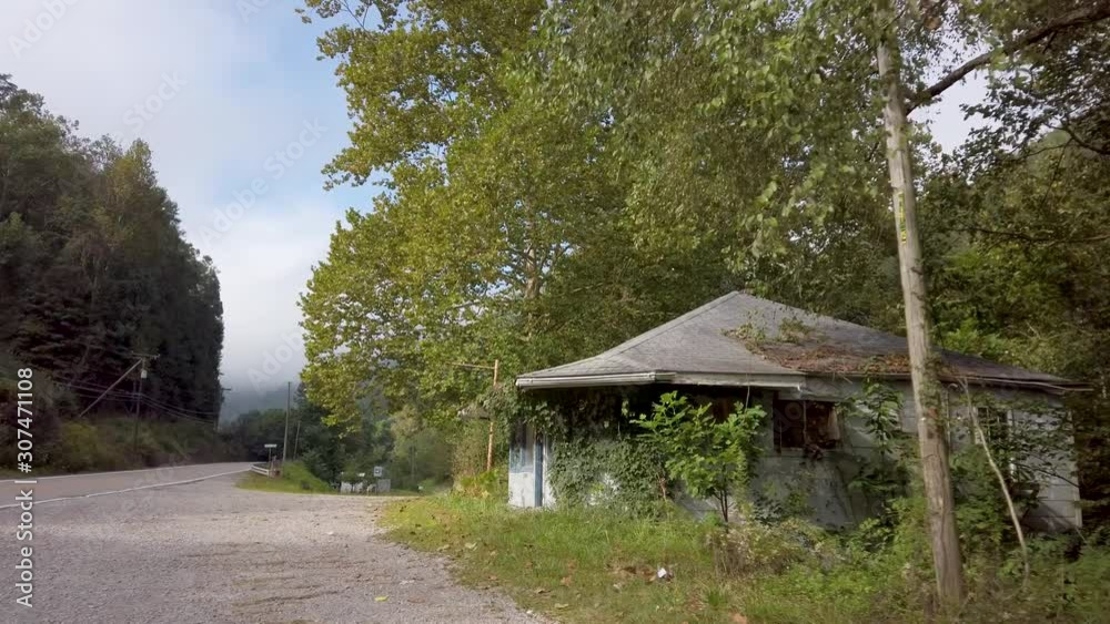 Camera pushes in to a derelict, abandoned Coal Miner Diner in a ghost town in West Virginia. Camera pushes in to a derelict, abandoned Coal Miner Diner in a ghost town in West Virginia.