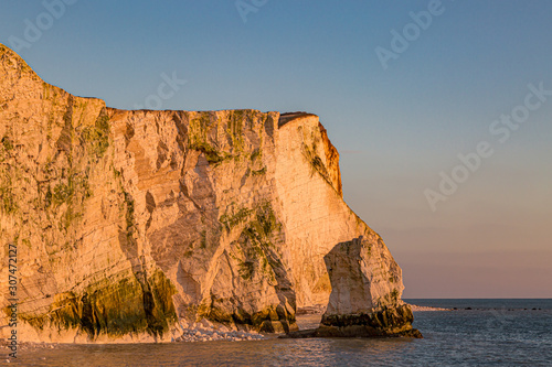 Evening light reflecting off the chalk cliffs at Seaford in Sussex