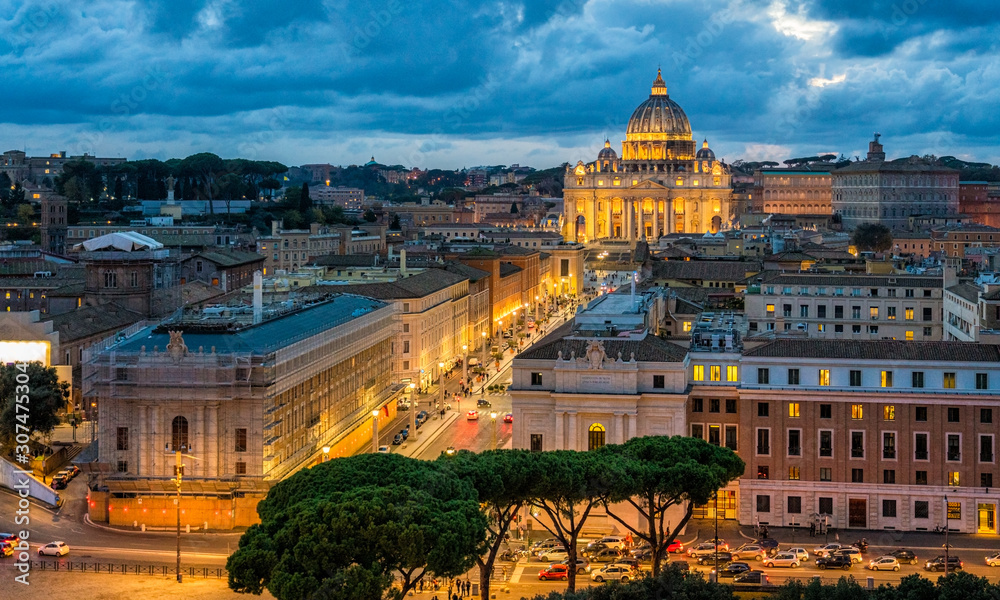 Panoramic night sight in Rome with Saint Peters Basilica, as seen from the Castel Sant'Angelo terrace.