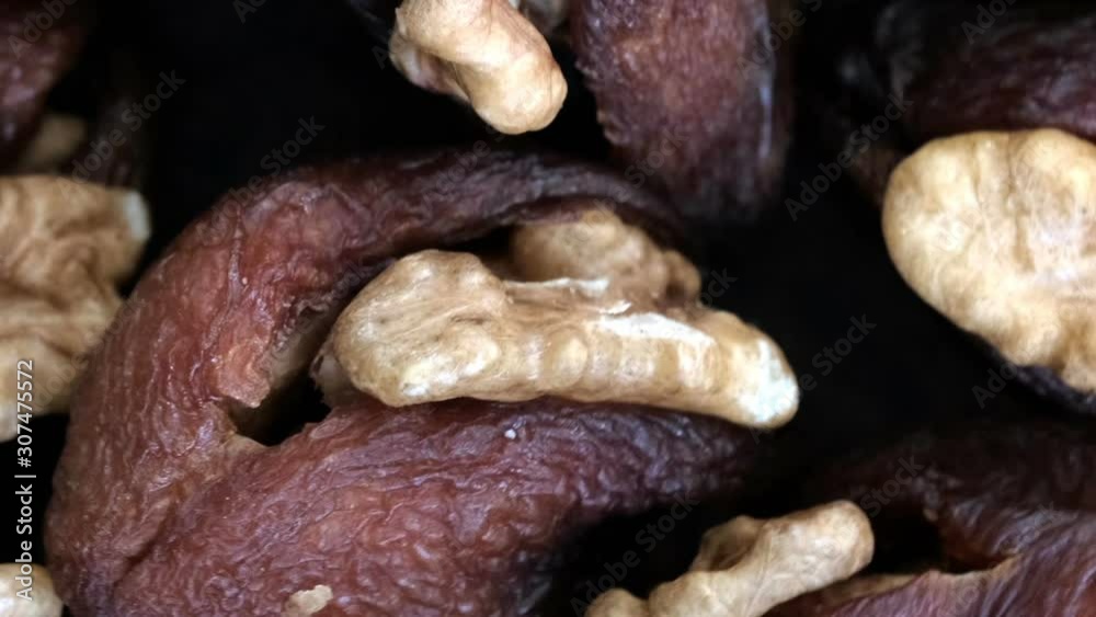 Grocery video screensaver, rotating background of dried apricots stuffed with walnut kernels using zoom and move the camera Grocery video screensaver, rotating background of dried apricots stuffed with walnut kernels using zoom and move the camera