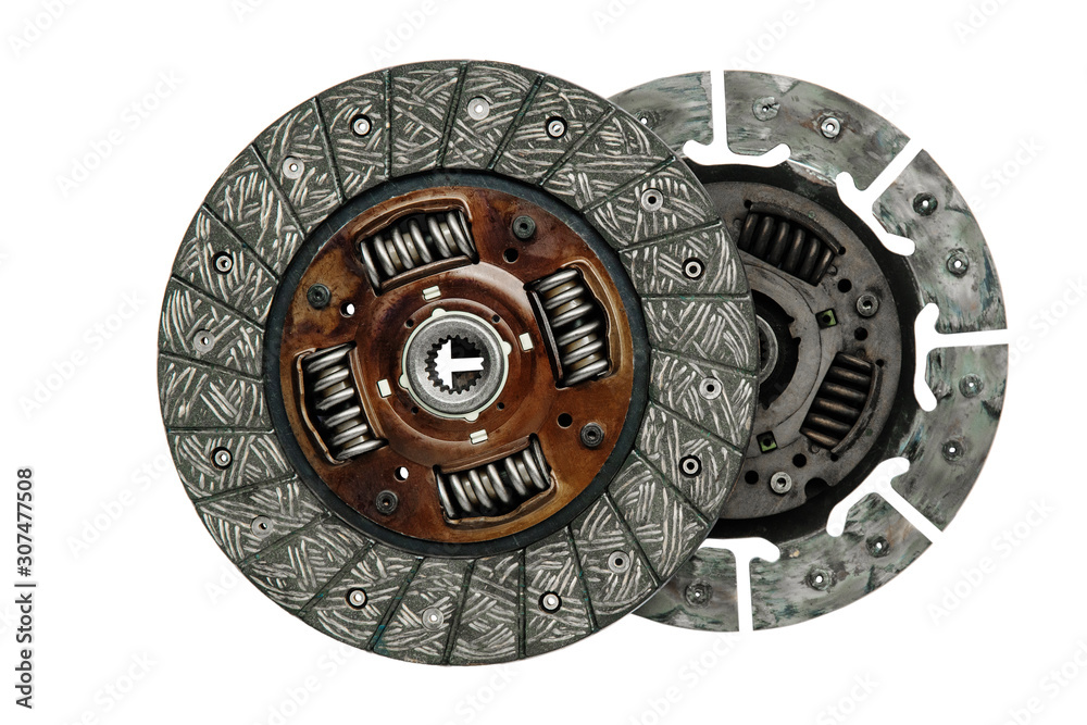 new car transmission clutch disc and used side by side on a white background