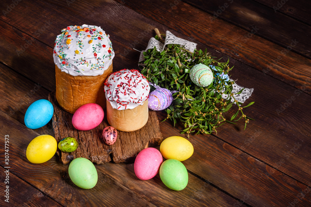 Easter cake and colorful eggs on a dark background Easter cake and colorful eggs on a dark background