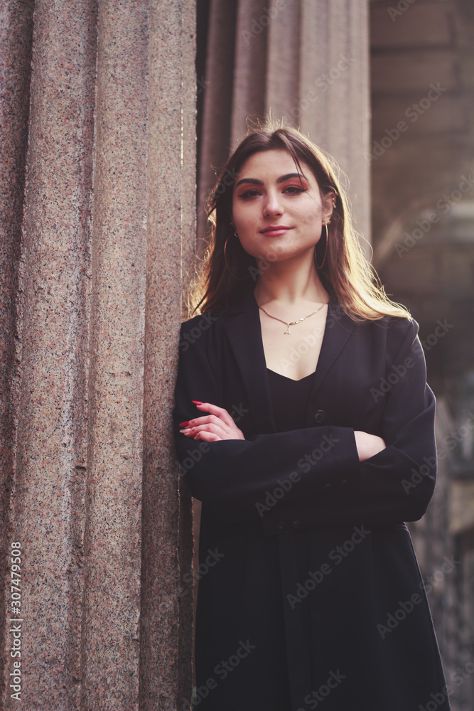 Model in black dress and long jacket. Style. Fashion trends 2020. Hair with ombre. Business lady. Blogger. Work