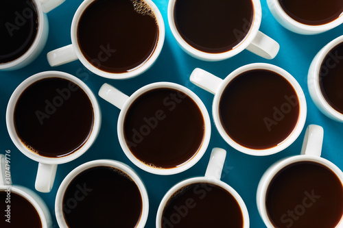 Overhead view of cups with black coffee © 365mm/Stocksy