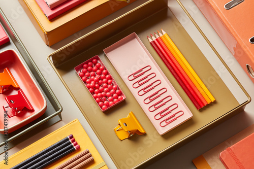 Multicolored office supplies on desk photo