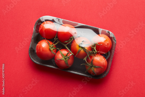Pack of tomatoes in plastic wrap