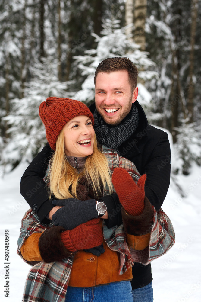 Obraz premium Couple in love, hugging, laughing heartily, love story