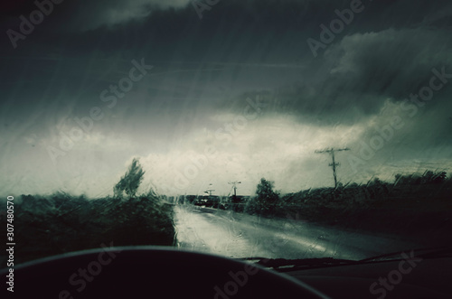 Dashboard rain on car windshield during storm photo