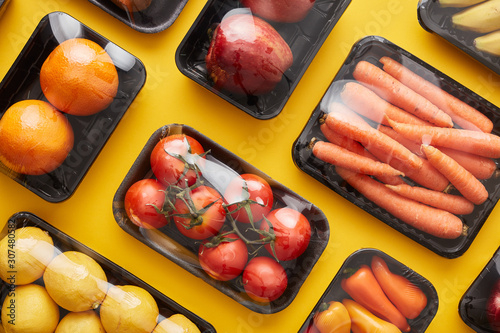 Plastic wrapped boxes of vegetables