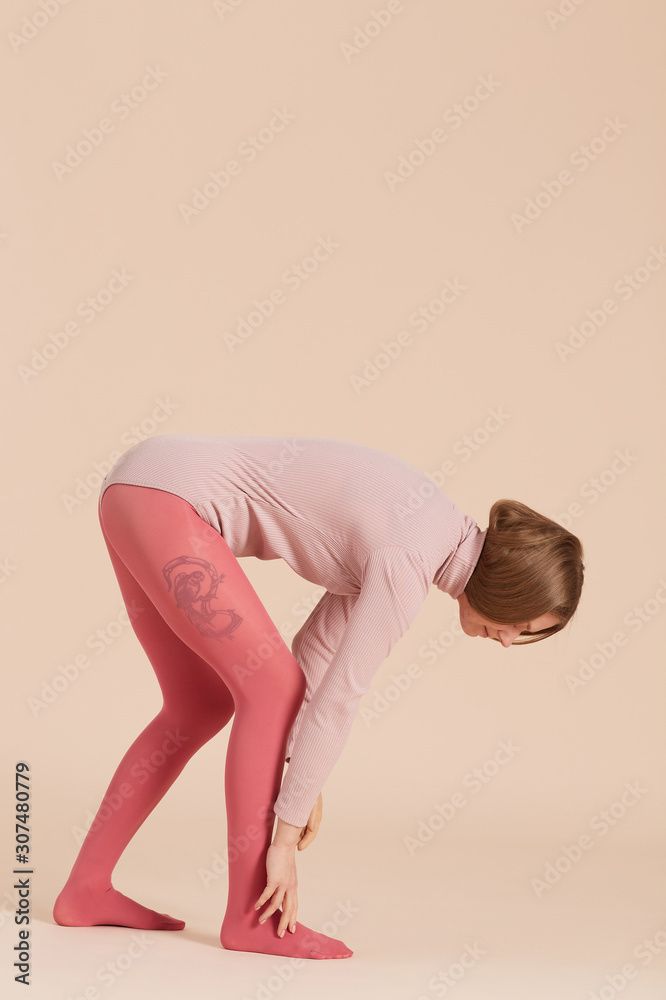 Girl Wearing Bodysuit And Tights Bending Forward Girl Wearing Bodysuit And Tights Bending Forward