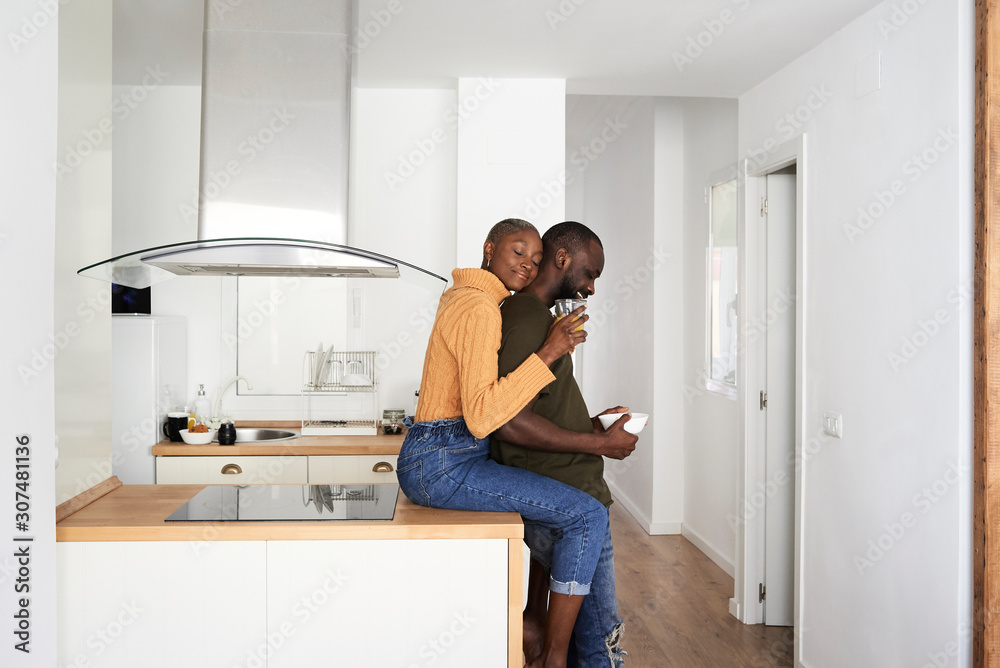 Tenderness black afro couple kitchen. Tenderness black afro couple kitchen.